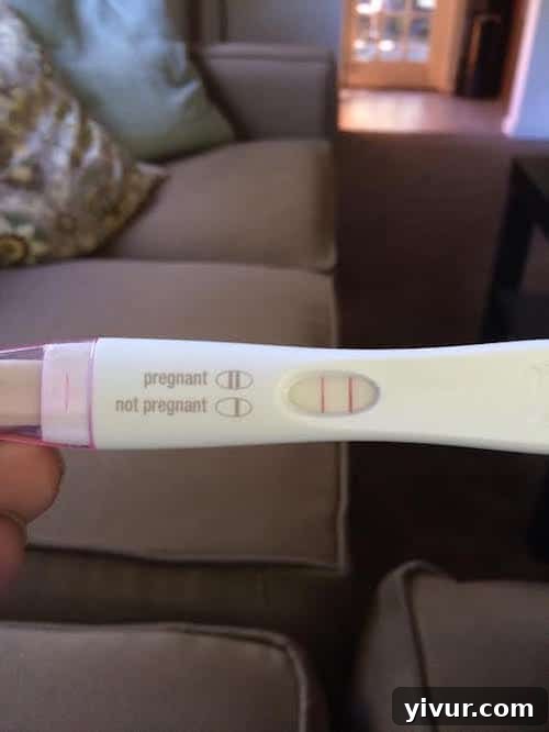 A positive pregnancy test with two distinct pink lines, symbolizing new beginnings.