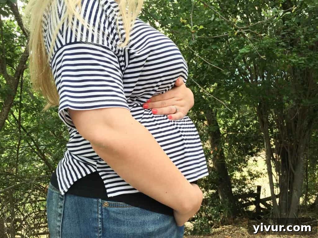 15 Weeks Pregnant: A subtle baby bump begins to show, marking a new stage in pregnancy.