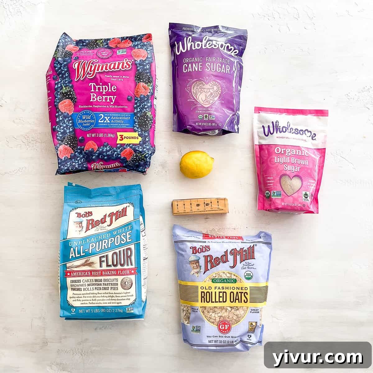 Quick Triple Berry Crumble from Frozen 3 A collection of fresh and frozen ingredients laid out for making a berry crumble recipe.