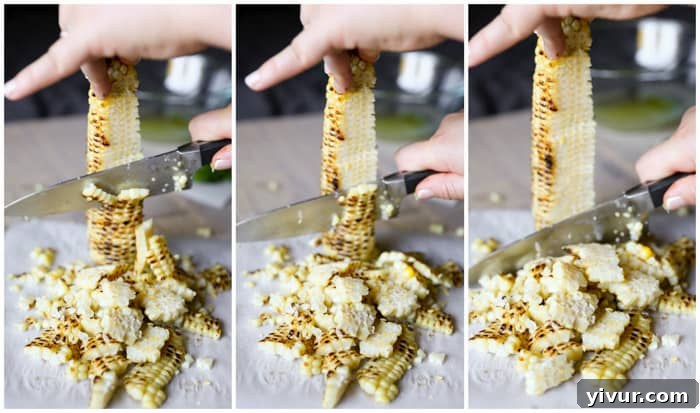 Cutting charred corn kernels off the cob
