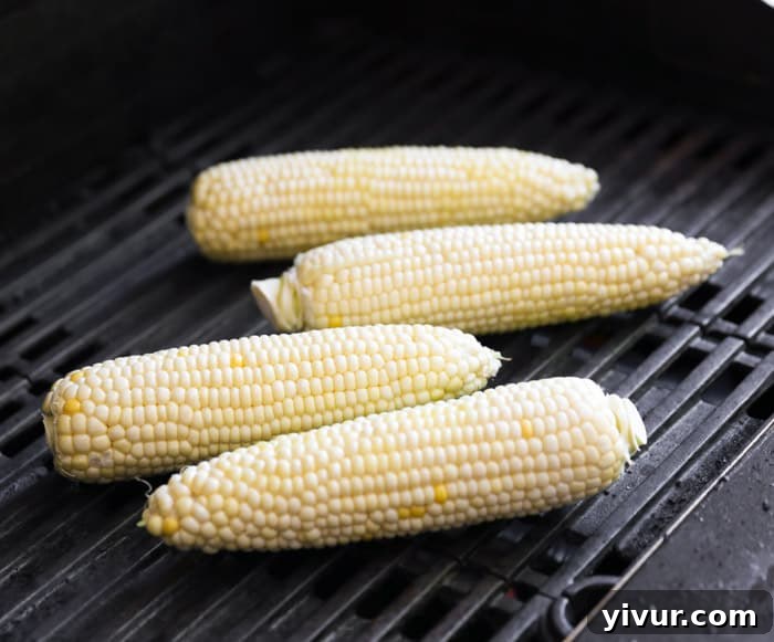 Charring fresh corn on the grill for a smoky flavor