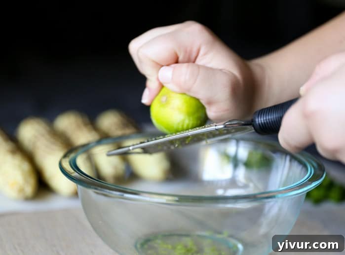 Zesting a fresh lime for the Mexican vinaigrette
