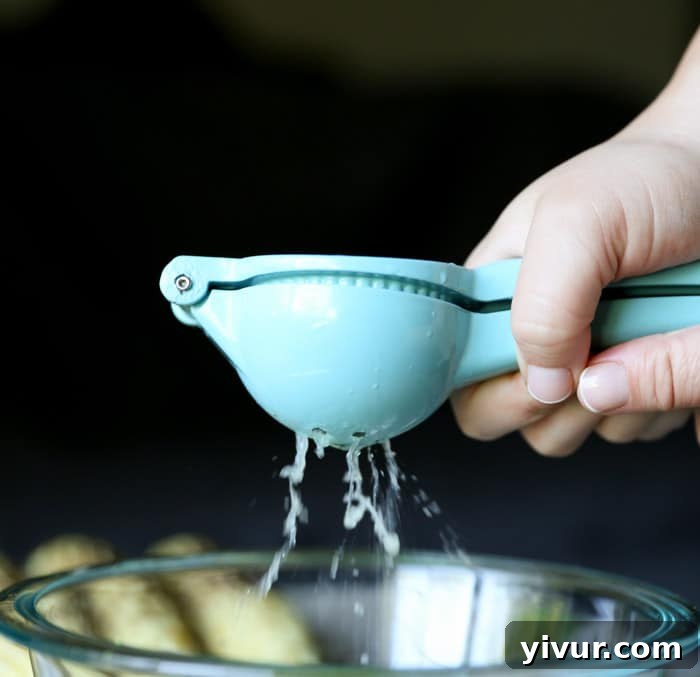 Squeezing fresh lime juice into the vinaigrette