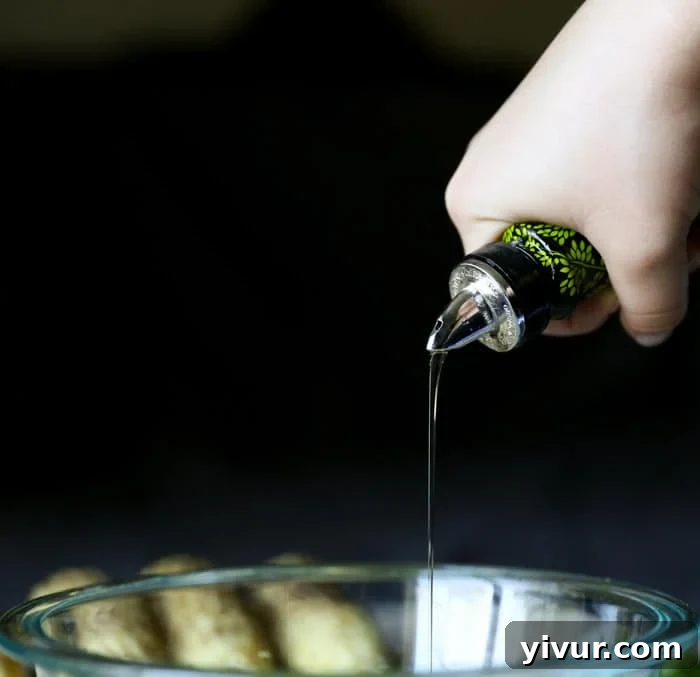 Adding olive oil to the lime juice and zest for the dressing