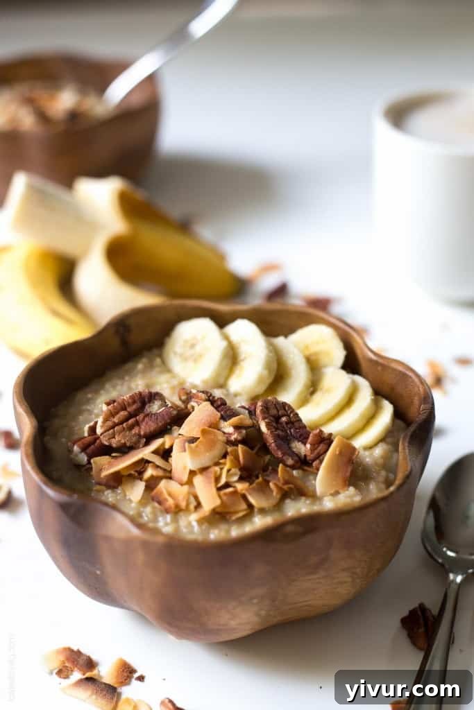 Tropical Coconut Banana Steel Cut Oats 3 Close-up of creamy Coconut Banana Steel Cut Oatmeal topped with toasted coconut and pecans.