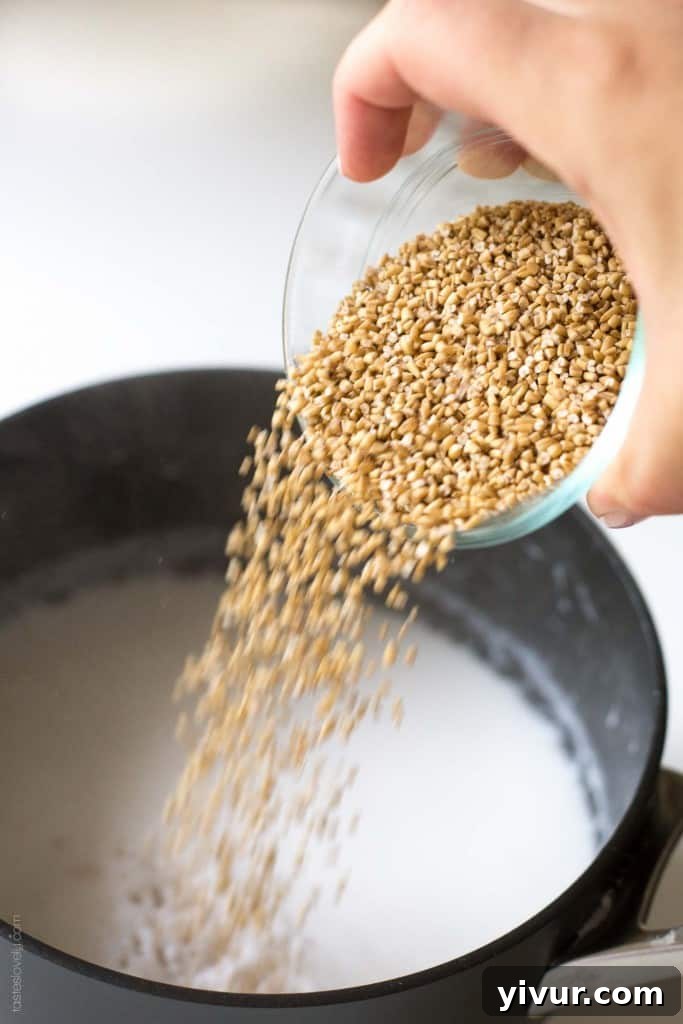 Tropical Coconut Banana Steel Cut Oats 4 A bowl of Coconut Banana Steel Cut Oatmeal garnished with fresh banana slices.