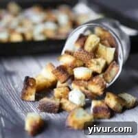 Crispy Garlic Parmesan Croutons 16 A bowl of fresh, homemade garlic parmesan croutons, glistening and golden.