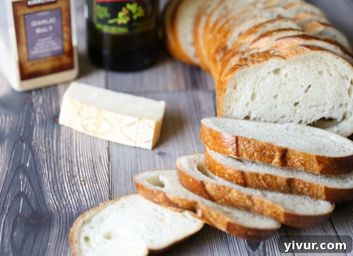 Crispy Garlic Parmesan Croutons 3 Four key ingredients for homemade croutons: a loaf of bread, olive oil, garlic salt, and a block of Parmesan cheese.