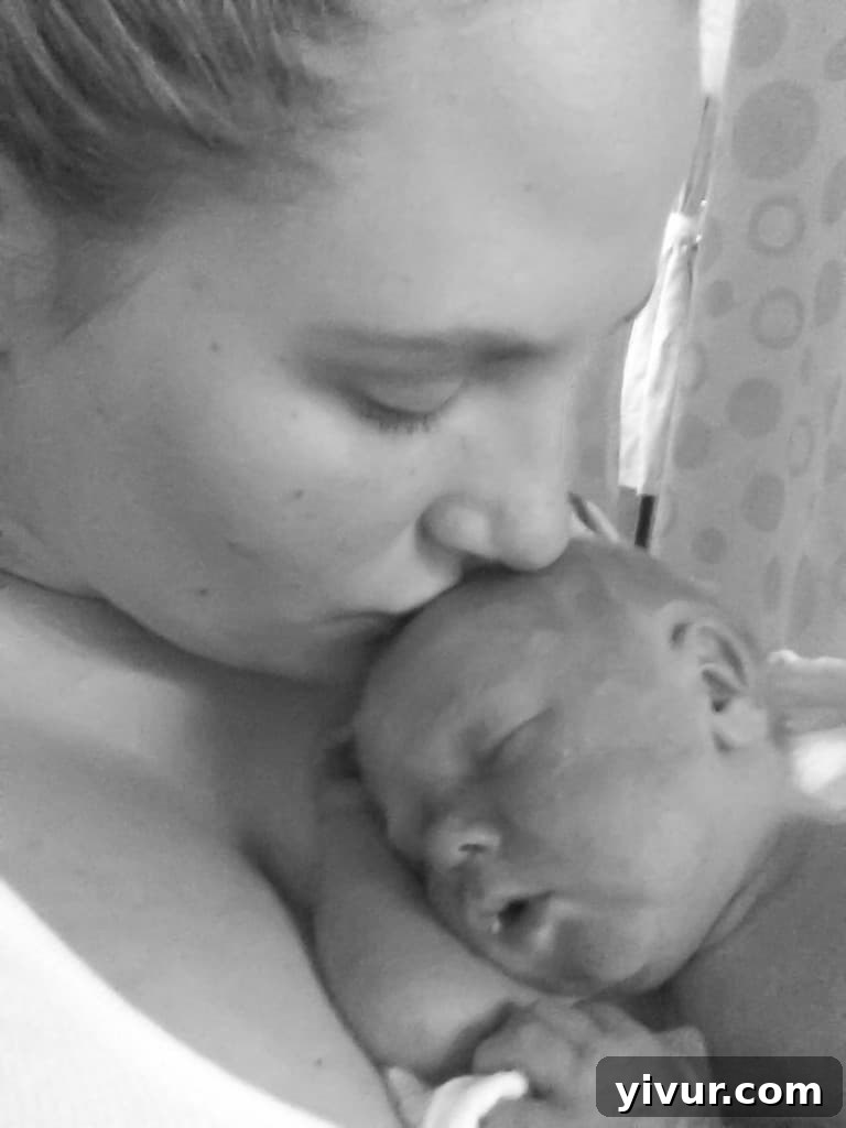 Mother holding baby Josh skin-to-skin for the first time after he came off breathing support