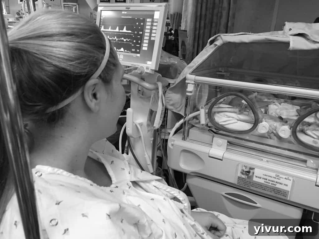 First moment sitting with baby Josh in the NICU, hands in isolette