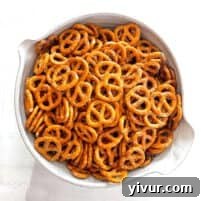 A white bowl filled with pretzel twists, ready for serving.