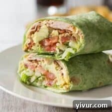 turkey bacon spinach wrap on a white plate