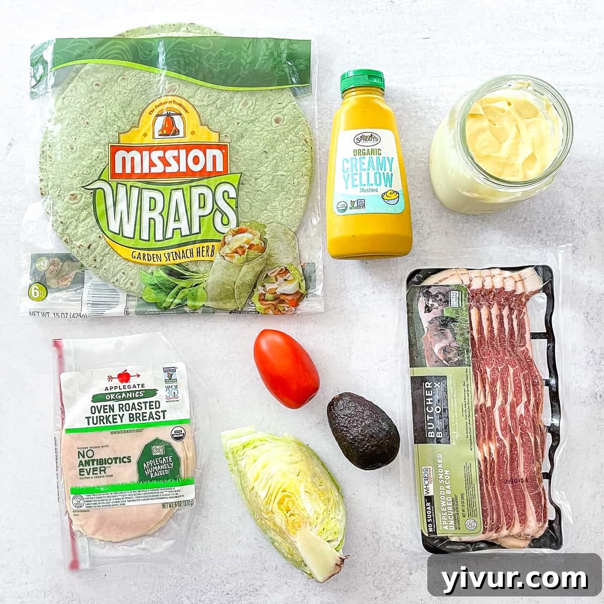 ingredients for to make a club sandwich in a spinach tortilla