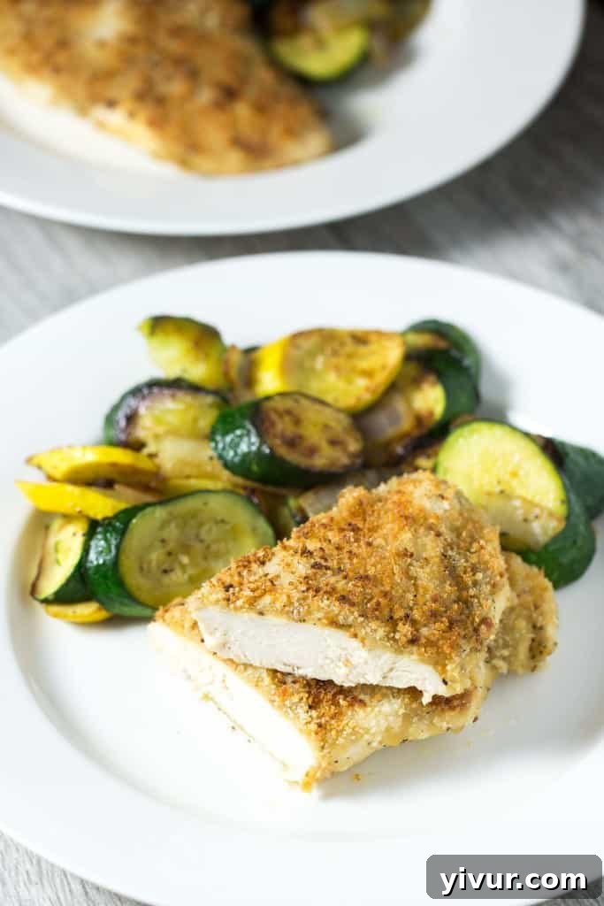 Succulent Crispy Oven Baked Honey Mustard Chicken served with fresh herbs.