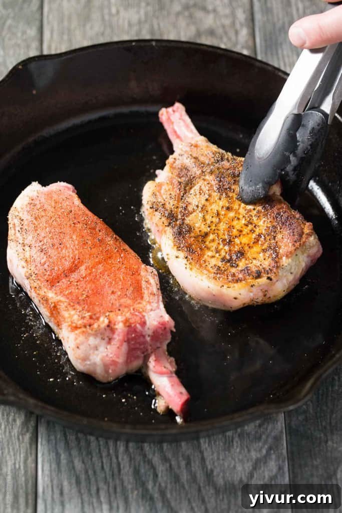 Sun-Kissed Pork Chops with Zesty Orange Parsley: Whole30 and Keto Perfect 6 Another perspective of the delicious pan-seared bone-in pork chops, highlighting the fresh, vibrant orange parsley sauce.