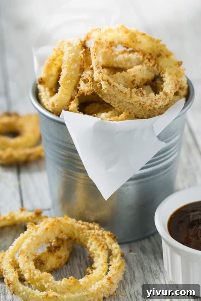 Golden Rings of Oven-Baked Crunch 3 Crispy Oven Baked Onion Rings - Close-up of a stack of golden onion rings