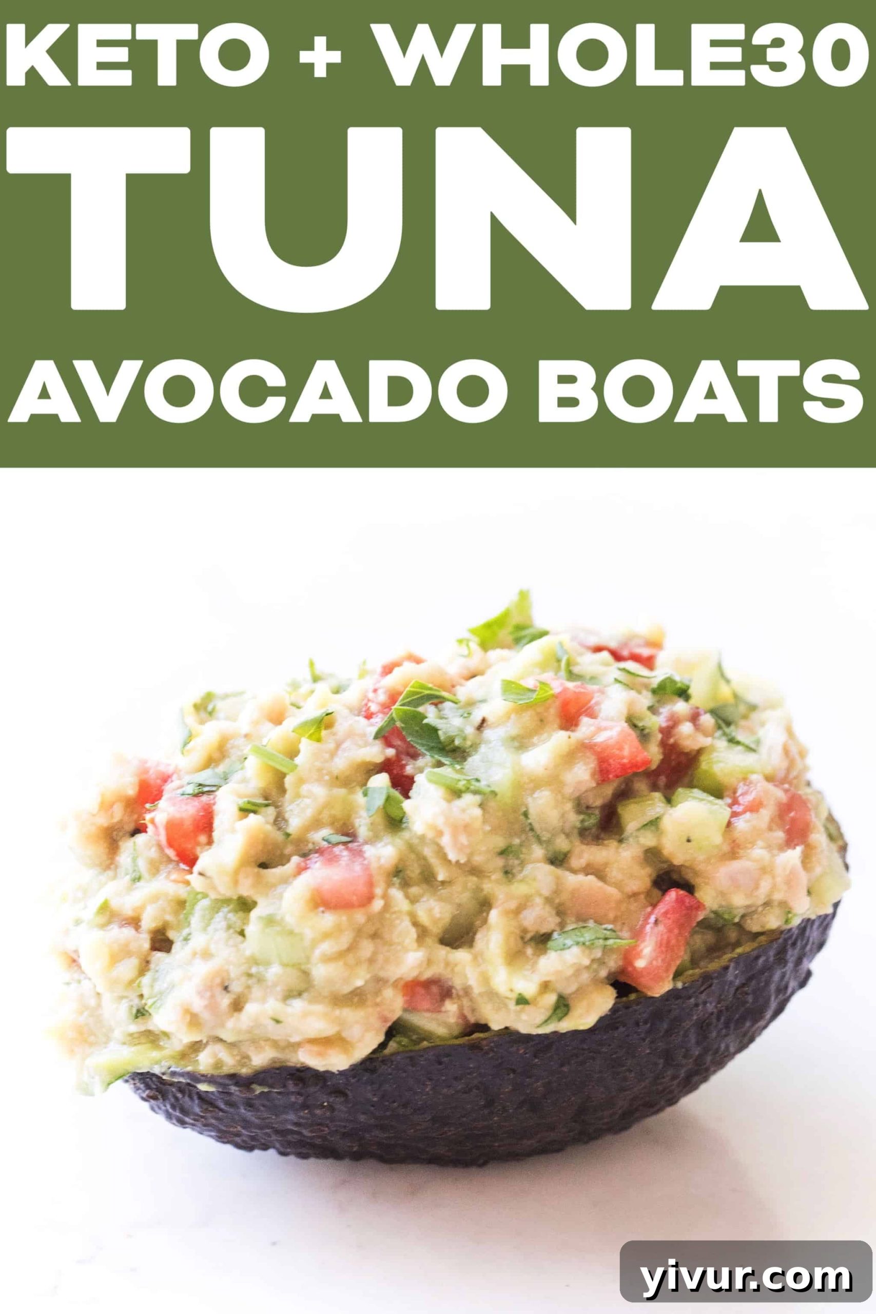 Whole30 + Keto Tuna Avocado Boats with fresh herbs as garnish, showcasing a vibrant and healthy meal