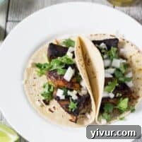 Street Style Crispy Carnitas Tacos with fresh toppings