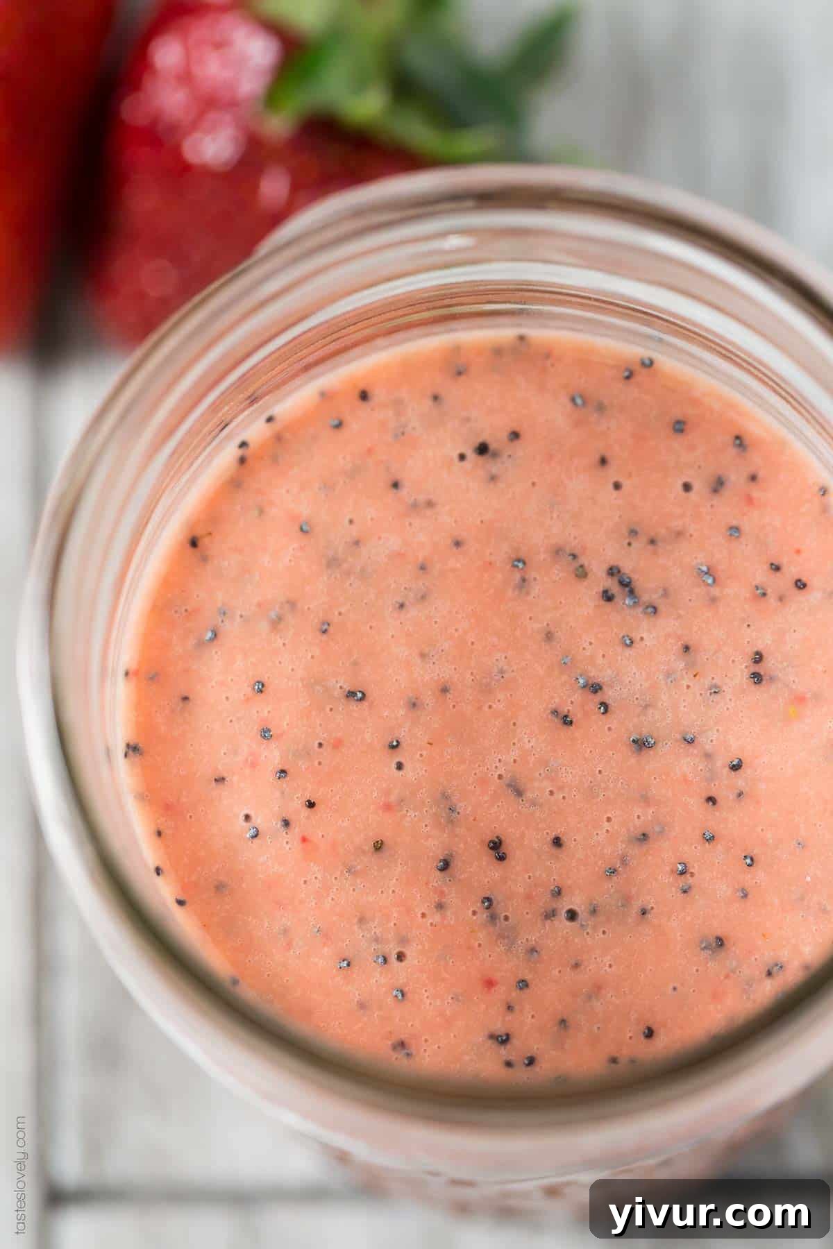 Ingredients for Paleo Strawberry Poppyseed Dressing laid out on a kitchen counter
