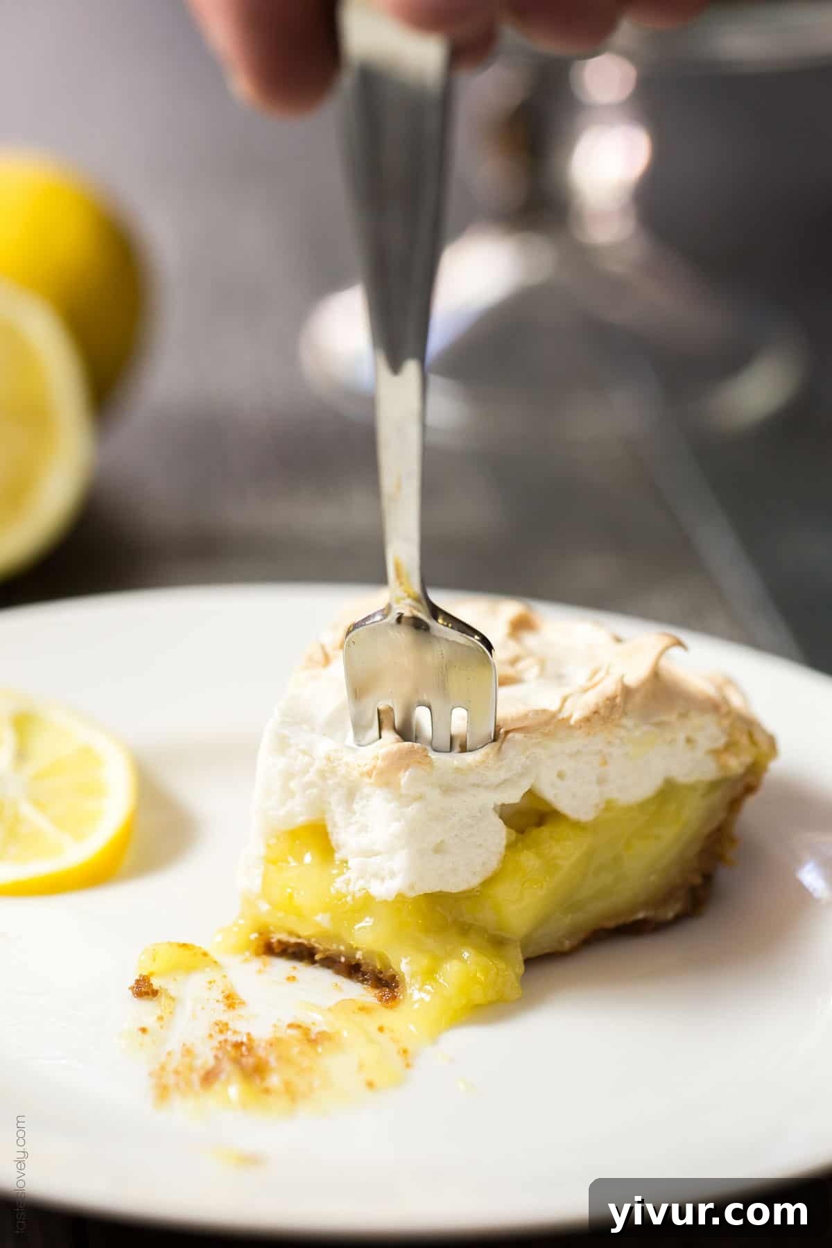 Serving slice of the dairy-free coconut oil lemon meringue pie