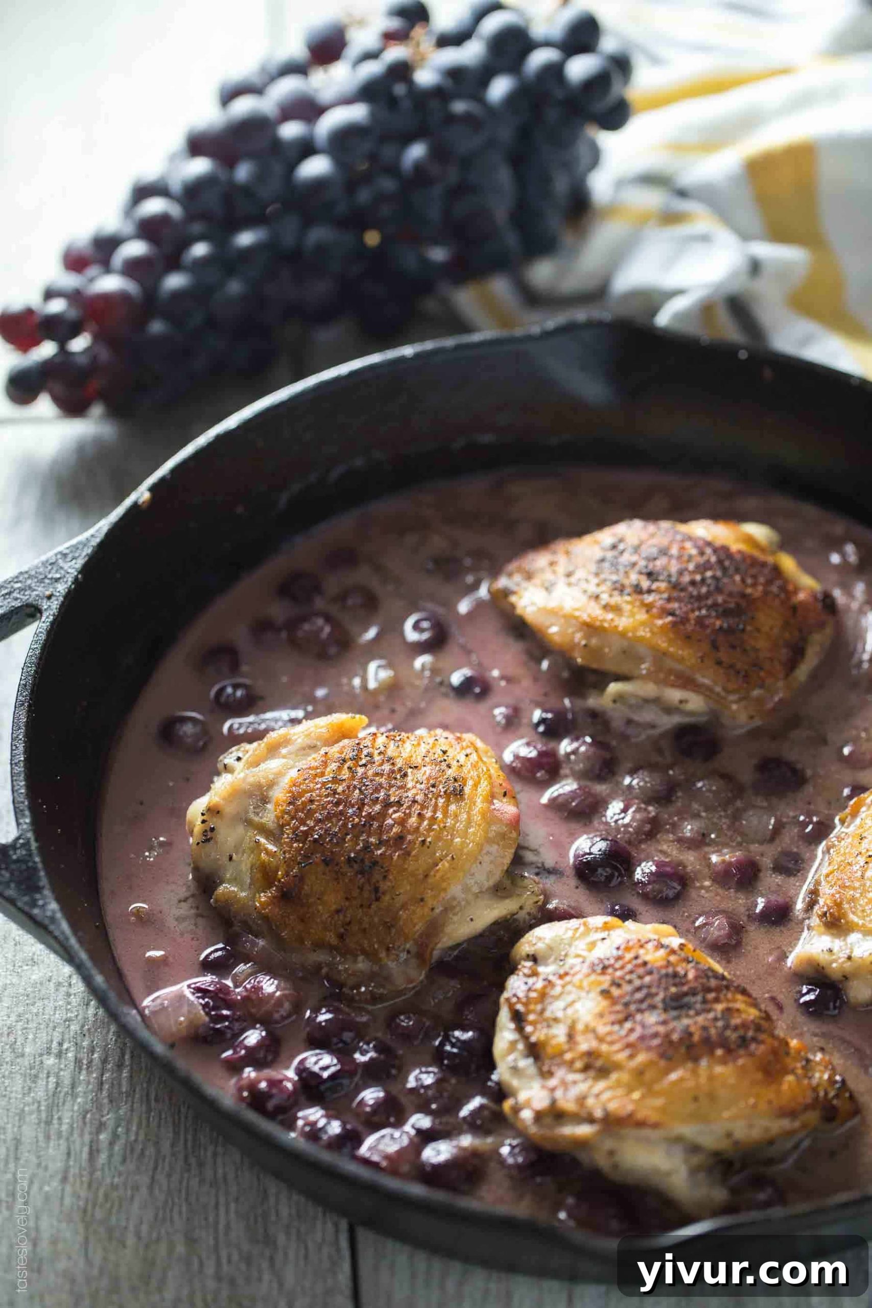 Crispy Skin Chicken Thighs Braised in Mustard Grape Sauce - A healthy fall or winter dinner recipe that is paleo, whole30, gluten free, and dairy free
