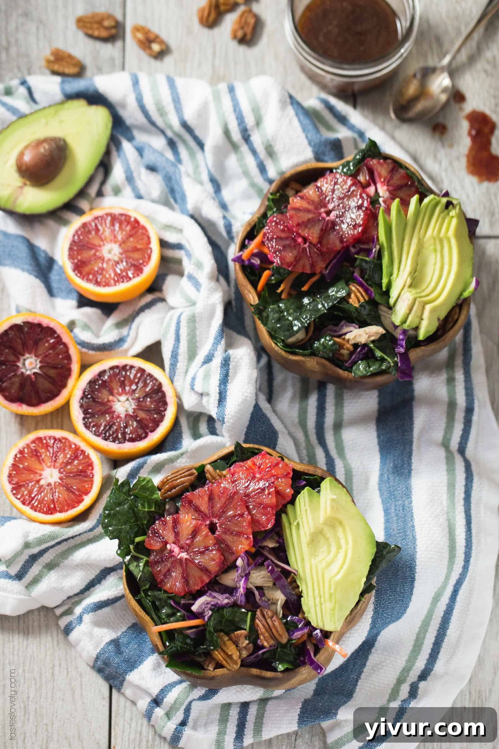 Close-up of blood orange slices and vinaigrette drizzled on the Winter Kale Salad