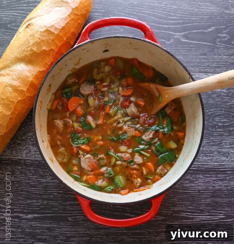Ingredients for Italian Sausage and Vegetable Soup laid out on a cutting board