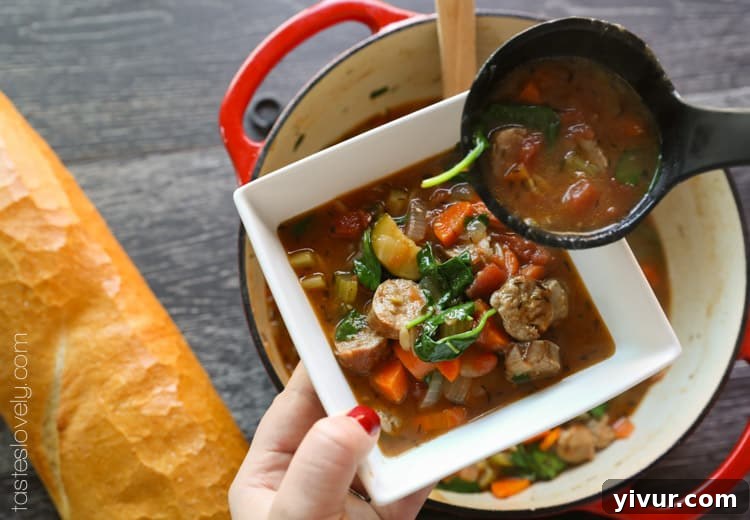 A bowl of delicious Italian Sausage and Vegetable Soup being served