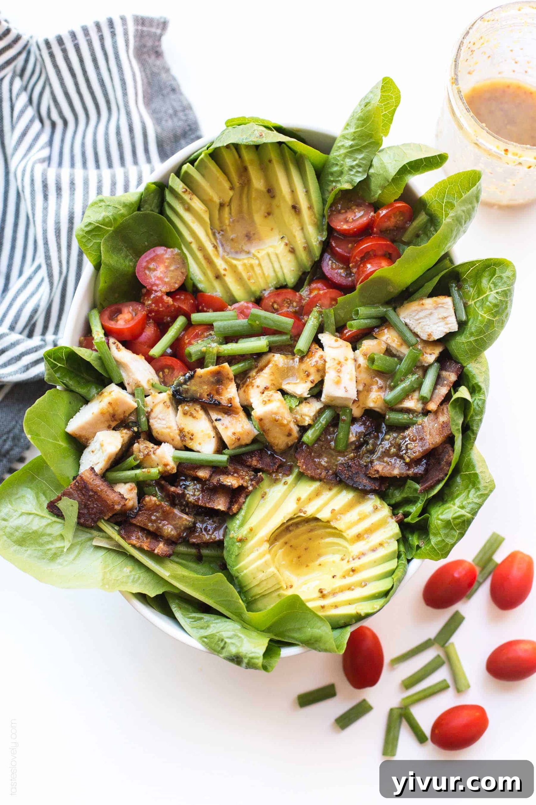 Paleo Honey Mustard Chicken Power Bowl with Crispy Bacon and Avocado 4 Prepared Honey Mustard Chicken, Bacon & Avocado Salad with dressing, showcasing the perfect balance of savory and sweet elements.