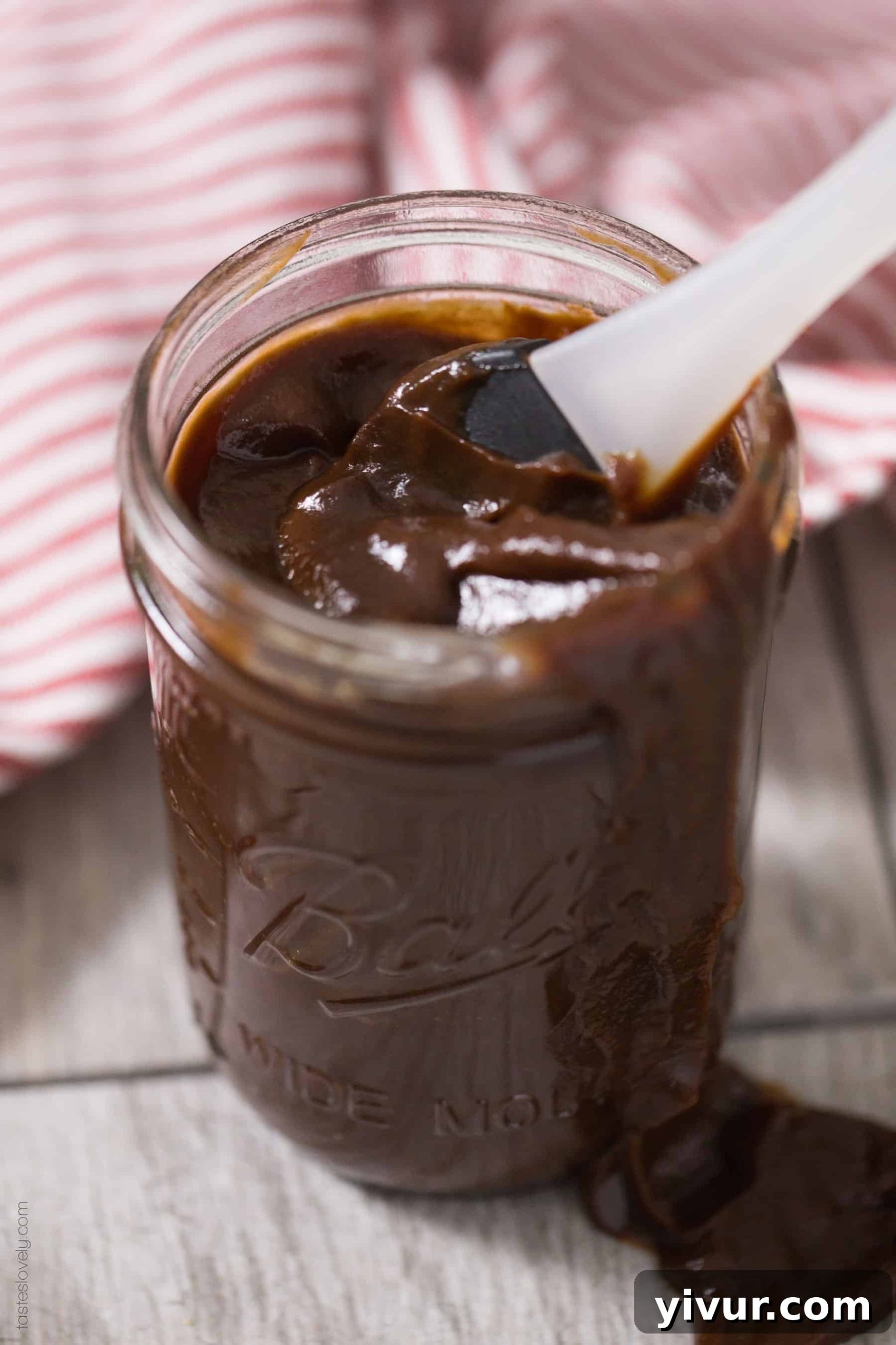 Jar of sugar-free BBQ sauce with lid off, ready to be used or stored.