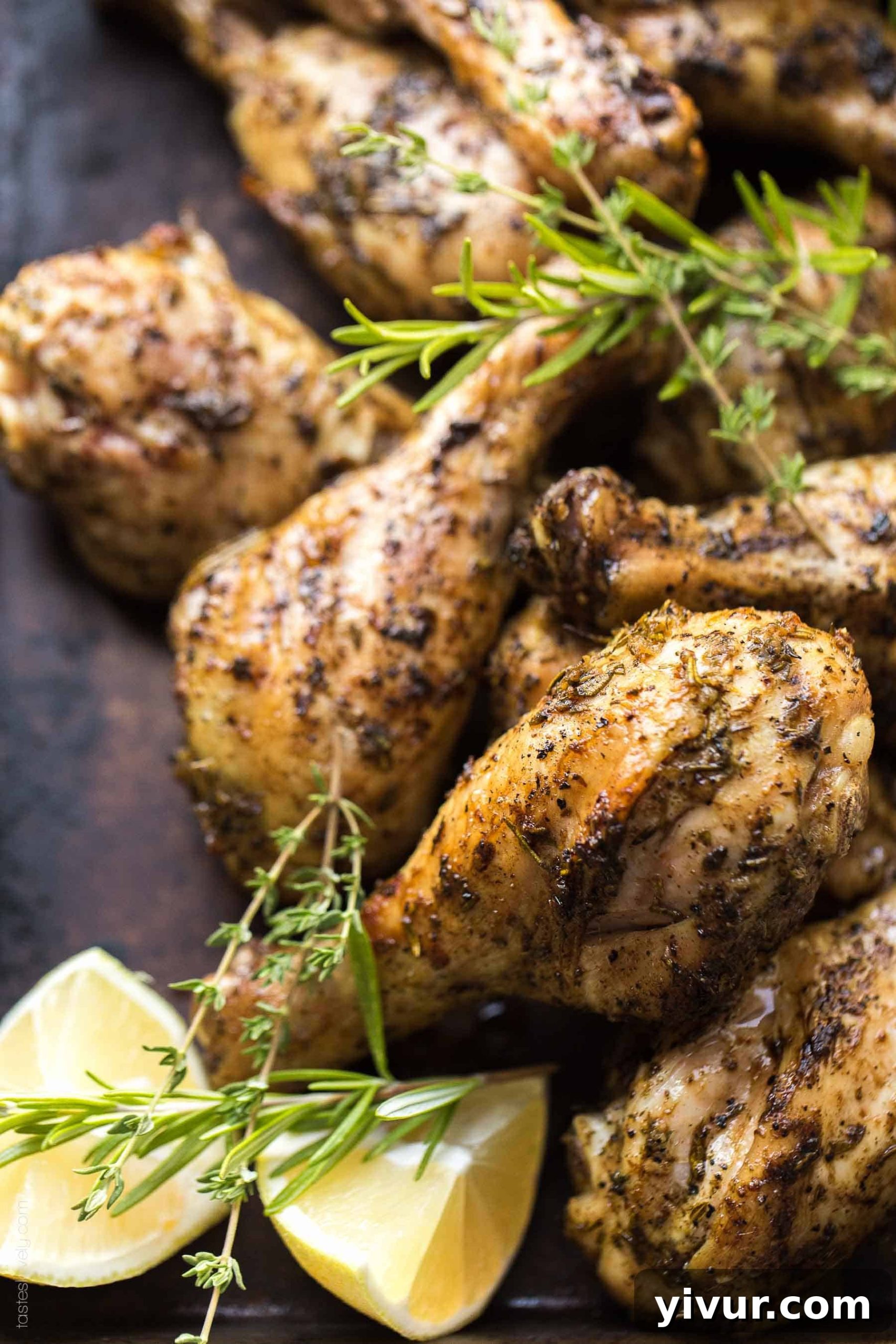 Crispy, golden-brown Grilled Lemon Herb Chicken Drumsticks marinating in a vibrant, fresh herb and lemon marinade, ready for a healthy summer dinner.