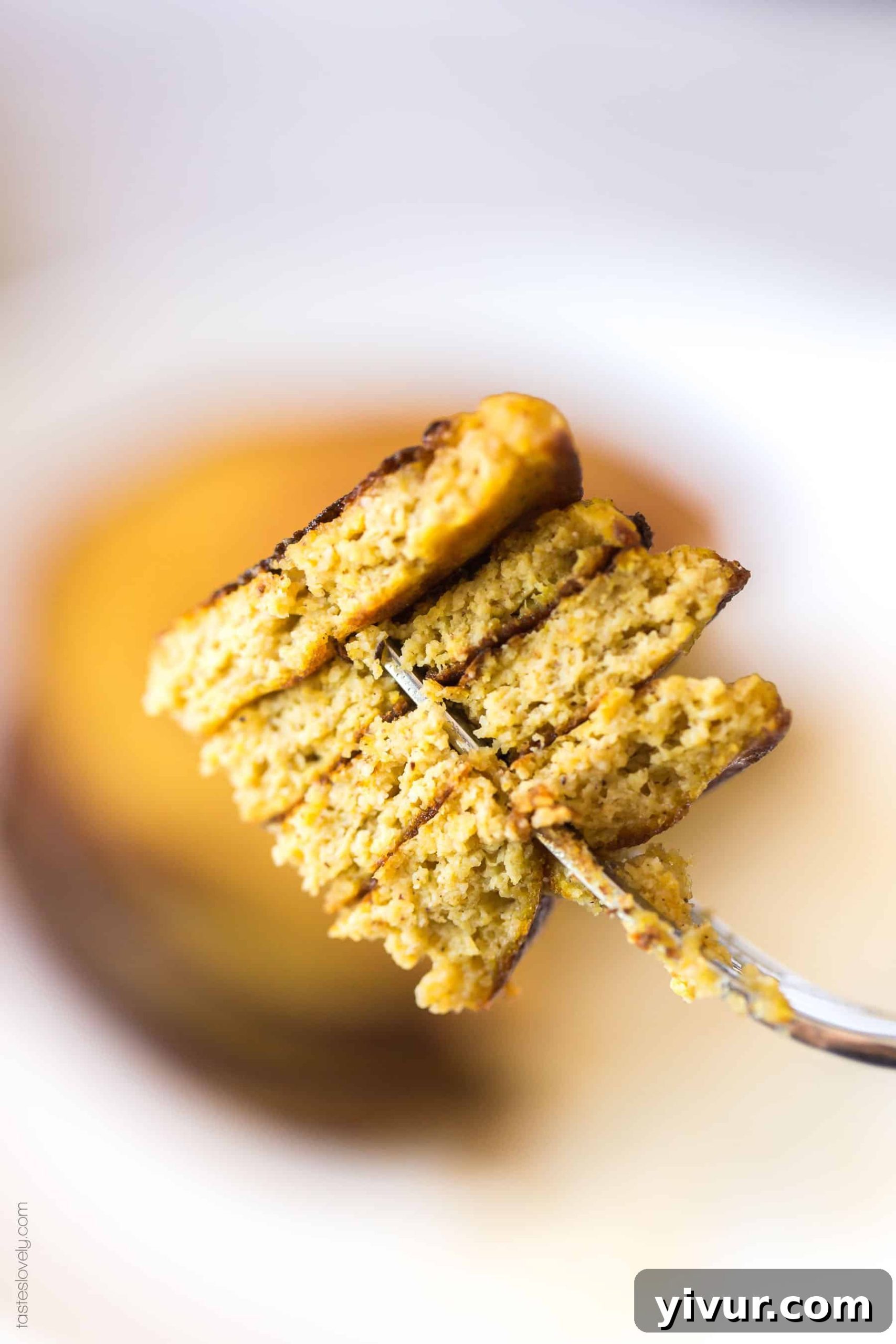 Perfectly cooked Keto and Paleo Pumpkin Pancakes stacked high, ready for delicious toppings and a cozy fall breakfast.