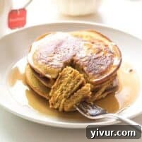 A plate of freshly made Keto and Paleo Pumpkin Pancakes, ready to be served and enjoyed as a healthy breakfast.