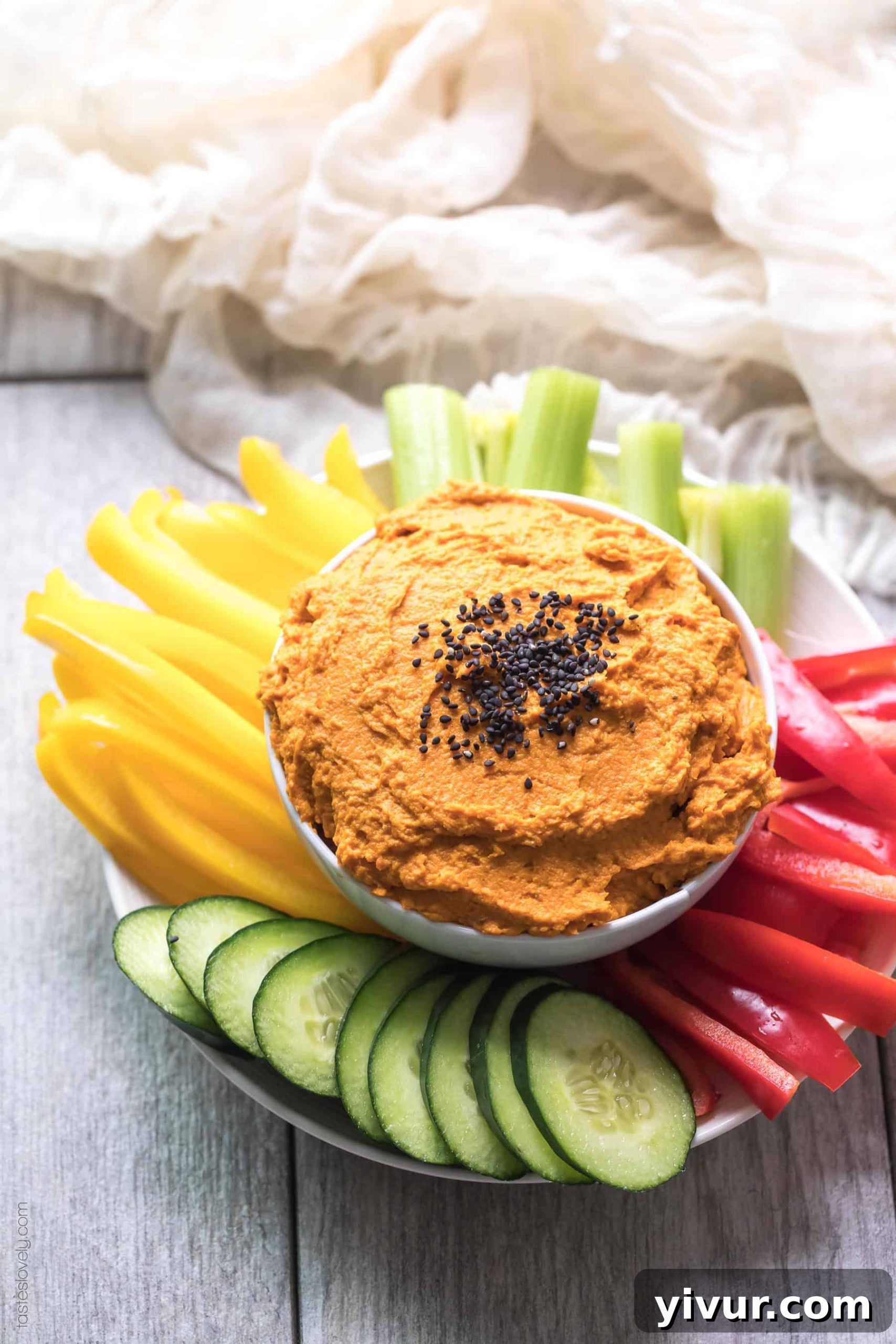 Creamy roasted carrot dip in a bowl, perfect for healthy snacking