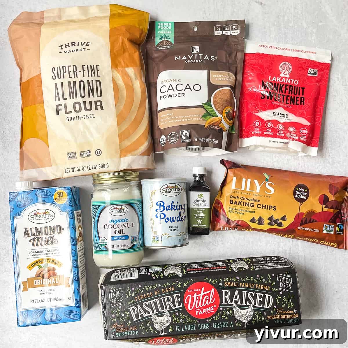 Decadent Dairy Free Keto Brownies Almond Flour 3 All the ingredients needed for this keto brownie recipe, including almond flour, cacao powder, monk fruit sweetener, and eggs, neatly arranged on a surface.