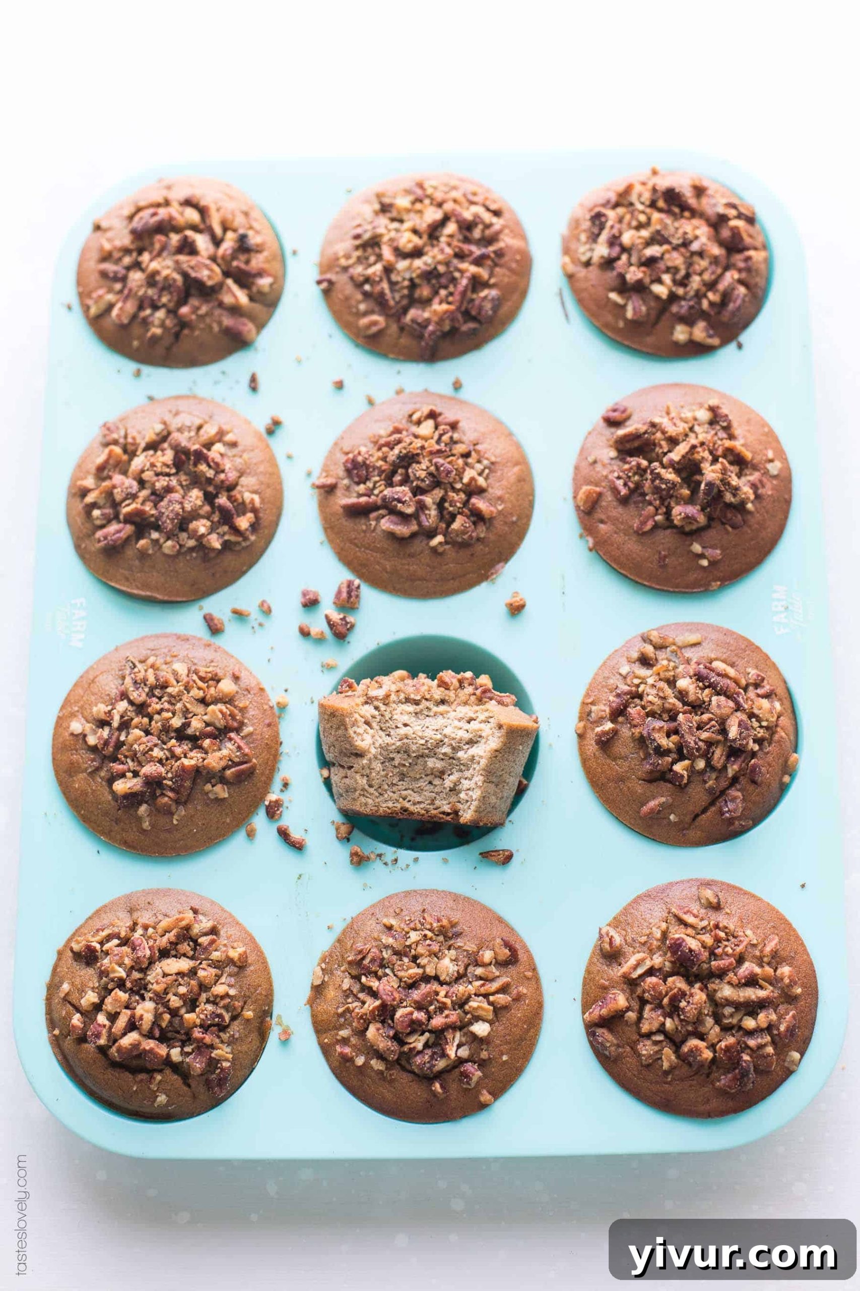 Paleo Chai Spice Banana Muffins nestled in a vibrant turquoise muffin pan, ready to be enjoyed.