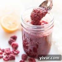 Finished Paleo Chia Seed Jam in a small glass jar.