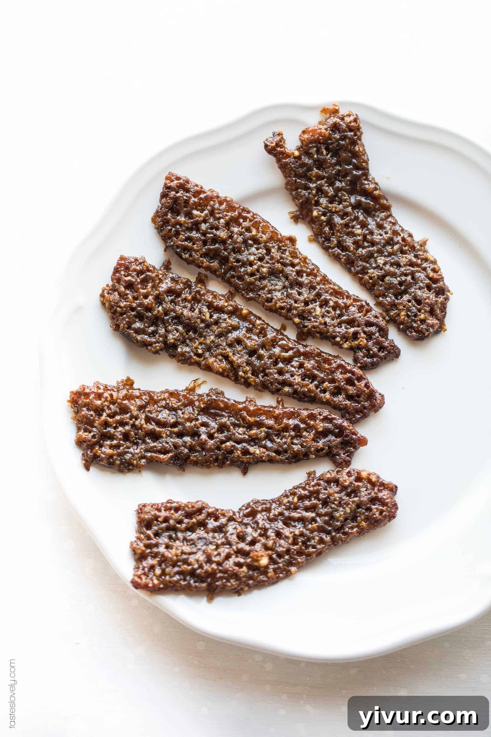 Close-up of golden brown Paleo Pecan Candied Bacon, showcasing its delightful salty-sweet crunch