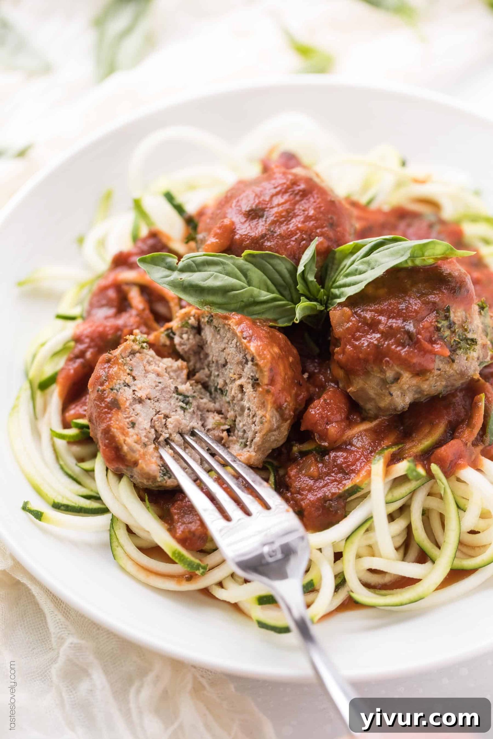 keto meatballs on plate with zucchini noodles