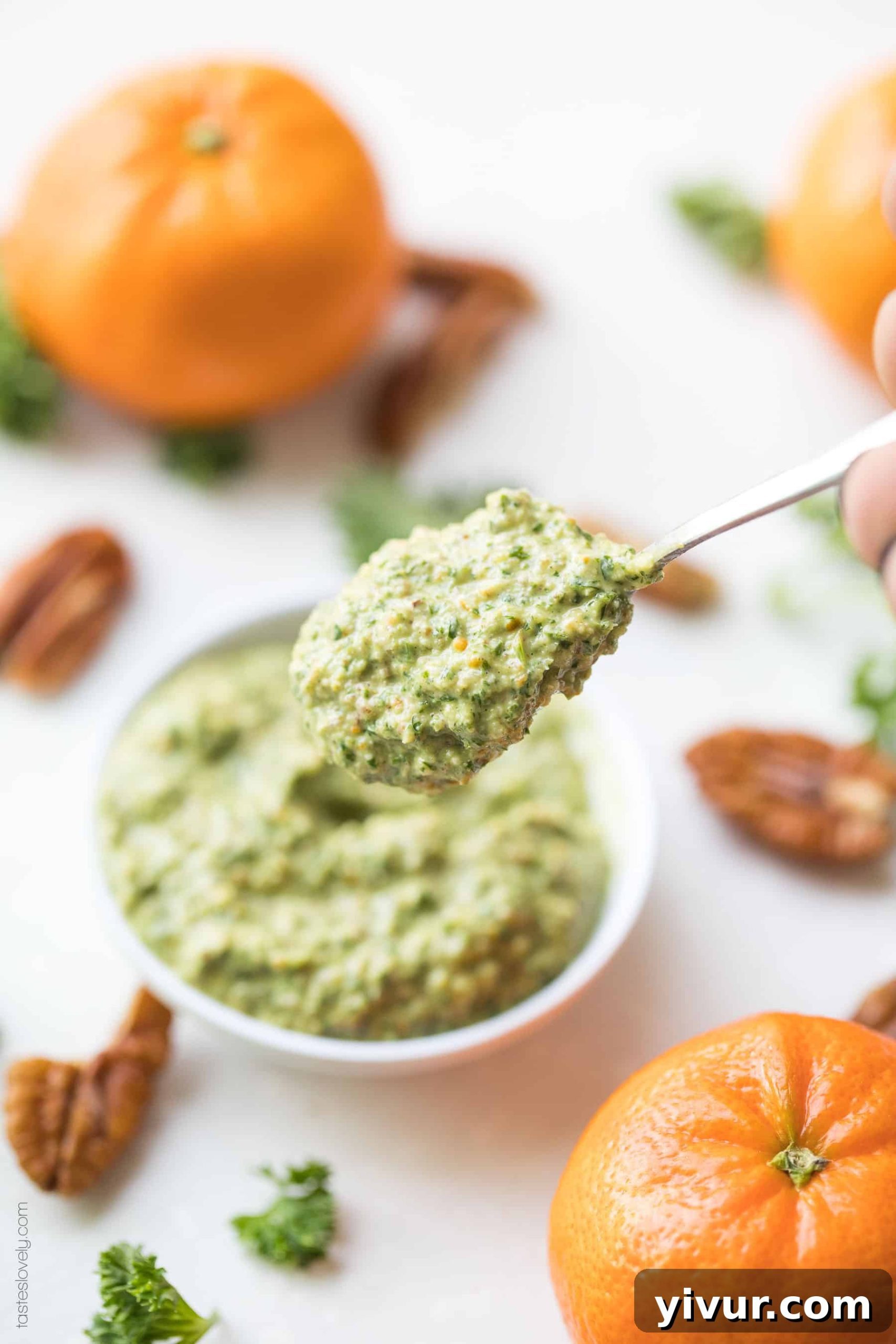 A close-up of the bright green Whole30 Keto Orange Parsley Sauce in a serving dish, highlighting its fresh and wholesome ingredients.