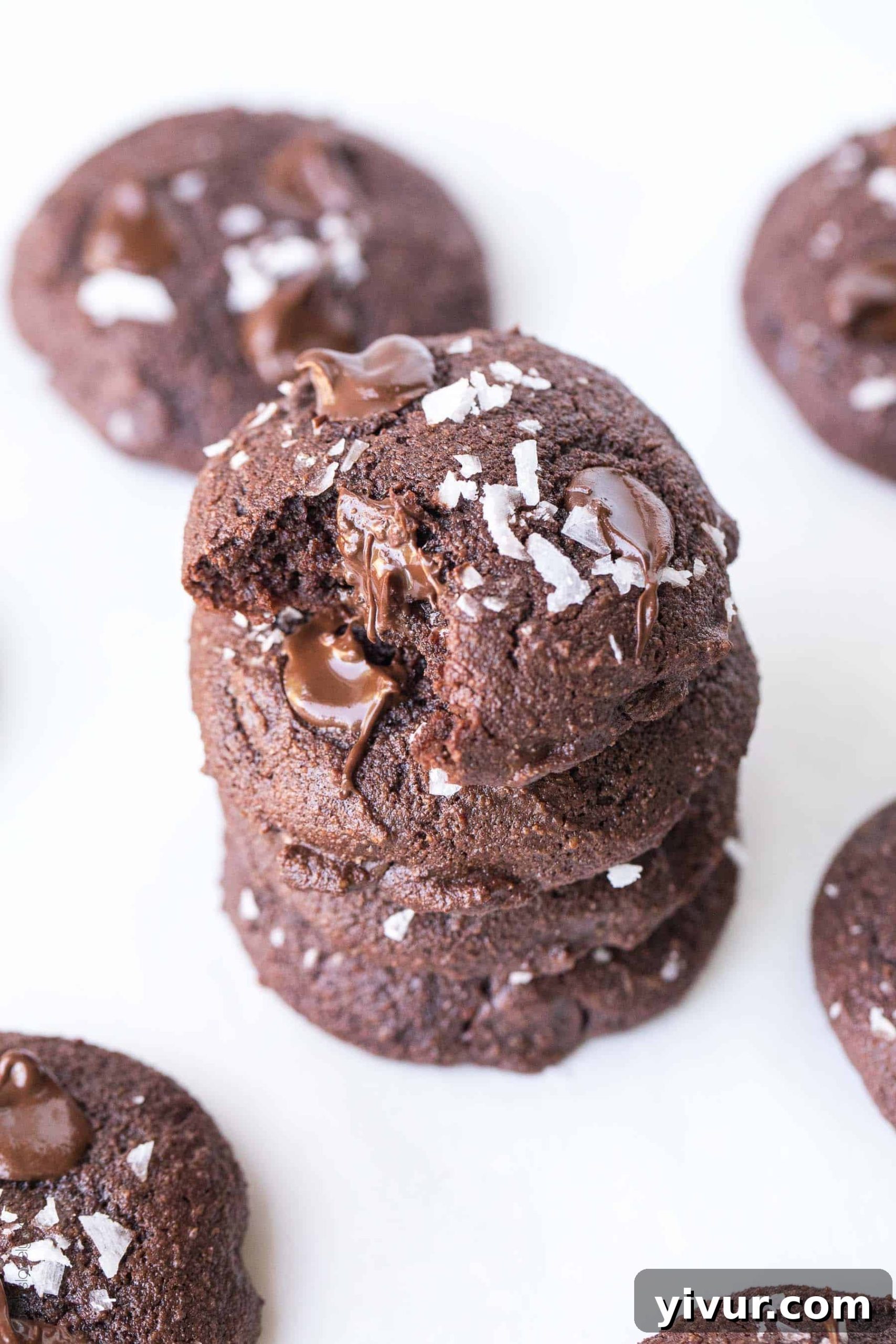 Keto Fudgy Sea Salt Chocolate Cookies 3 A close-up shot of a stack of Keto Salted Chocolate Brownie Cookies, highlighting their chewy center and slight crisp edges, ready to be enjoyed.