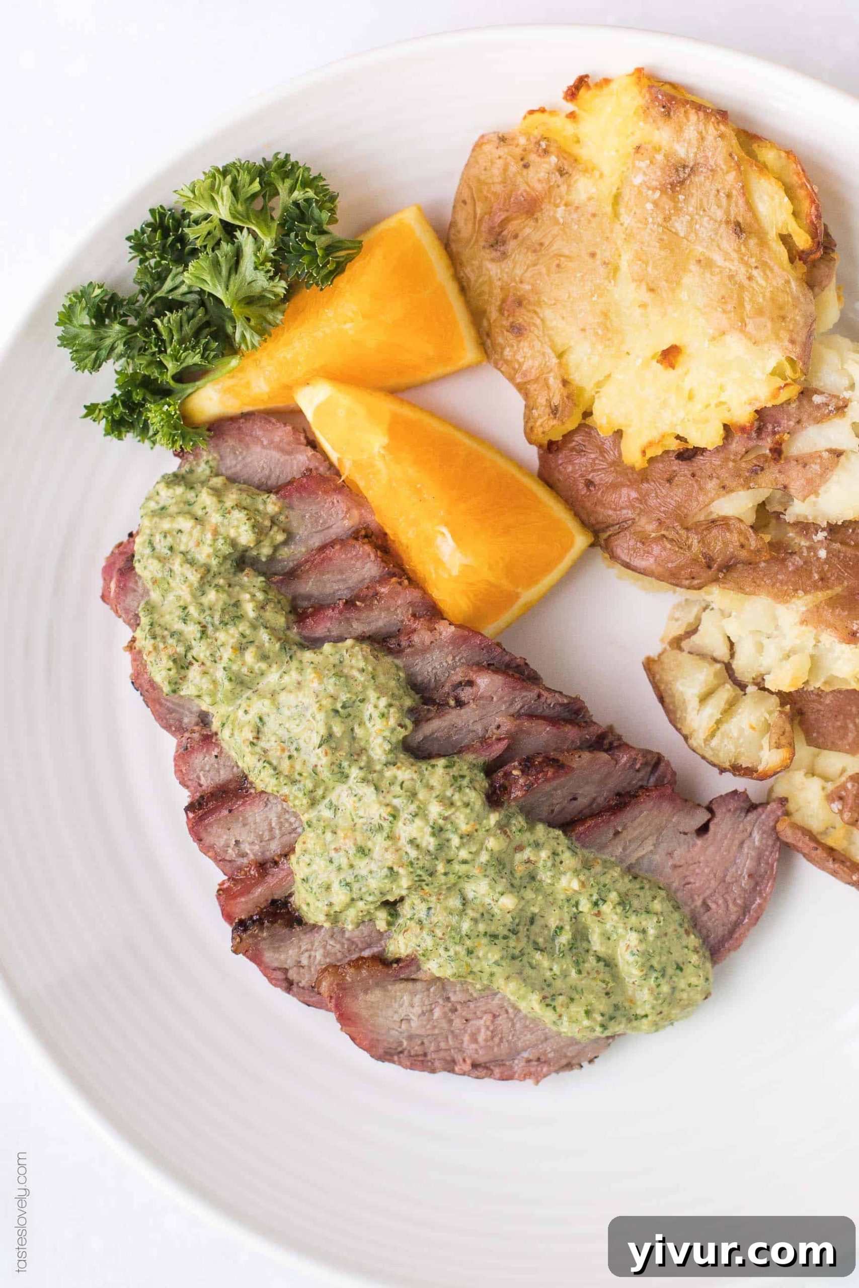 Whole30 Keto Tri Tip with Zesty Orange Parsley Sauce 3 Close-up of Whole30 Keto Tri Tip steak with bright orange parsley sauce, emphasizing its juicy texture and vibrant topping. Ideal for a healthy 30-minute dinner.