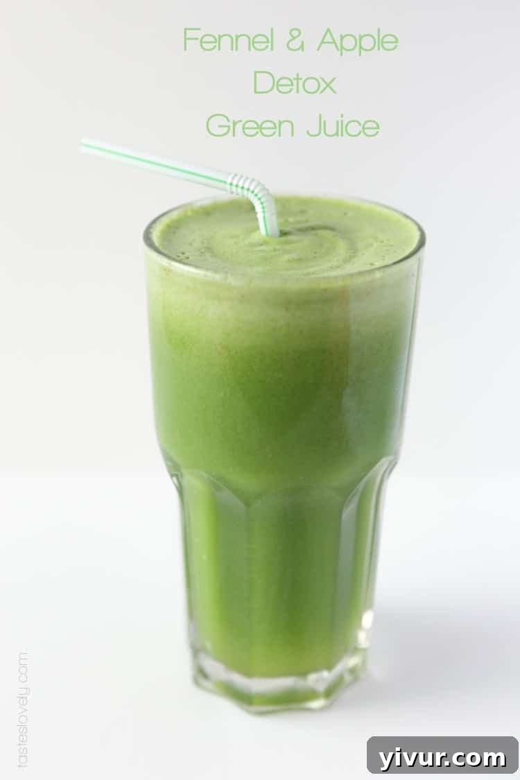 A vibrant glass of detox green juice, garnished with a straw, ready to be enjoyed.
