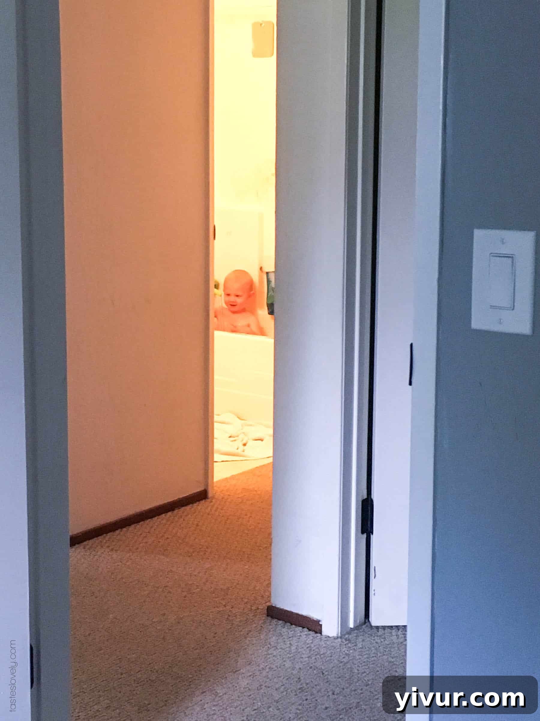 Spring 2018 A Daily Perspective 5 A toddler playing without pants on while mom cleans the kitchen, showcasing potty training success.