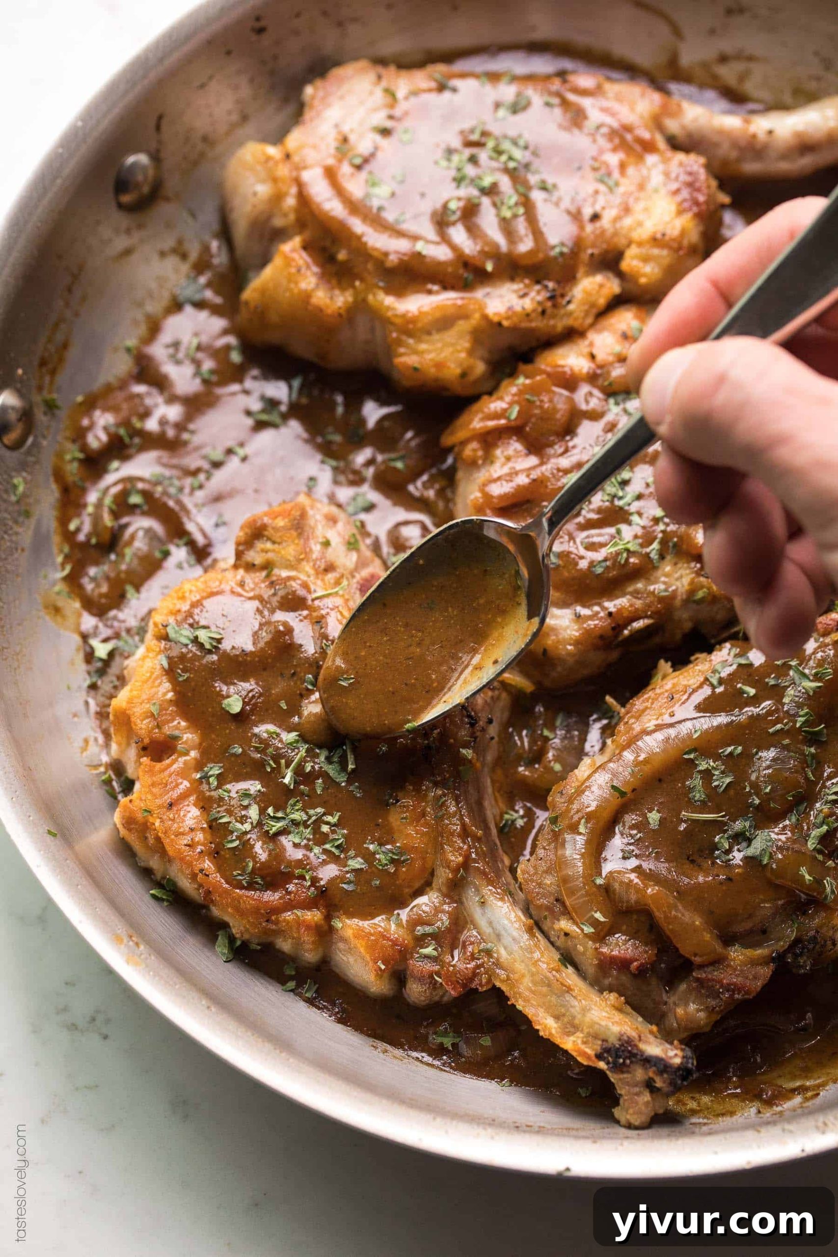 Flavorful Balsamic Mustard Pork Chops Whole30 and Keto 3 Spooning brown balsamic msutard sauce over pork chops in a skillet