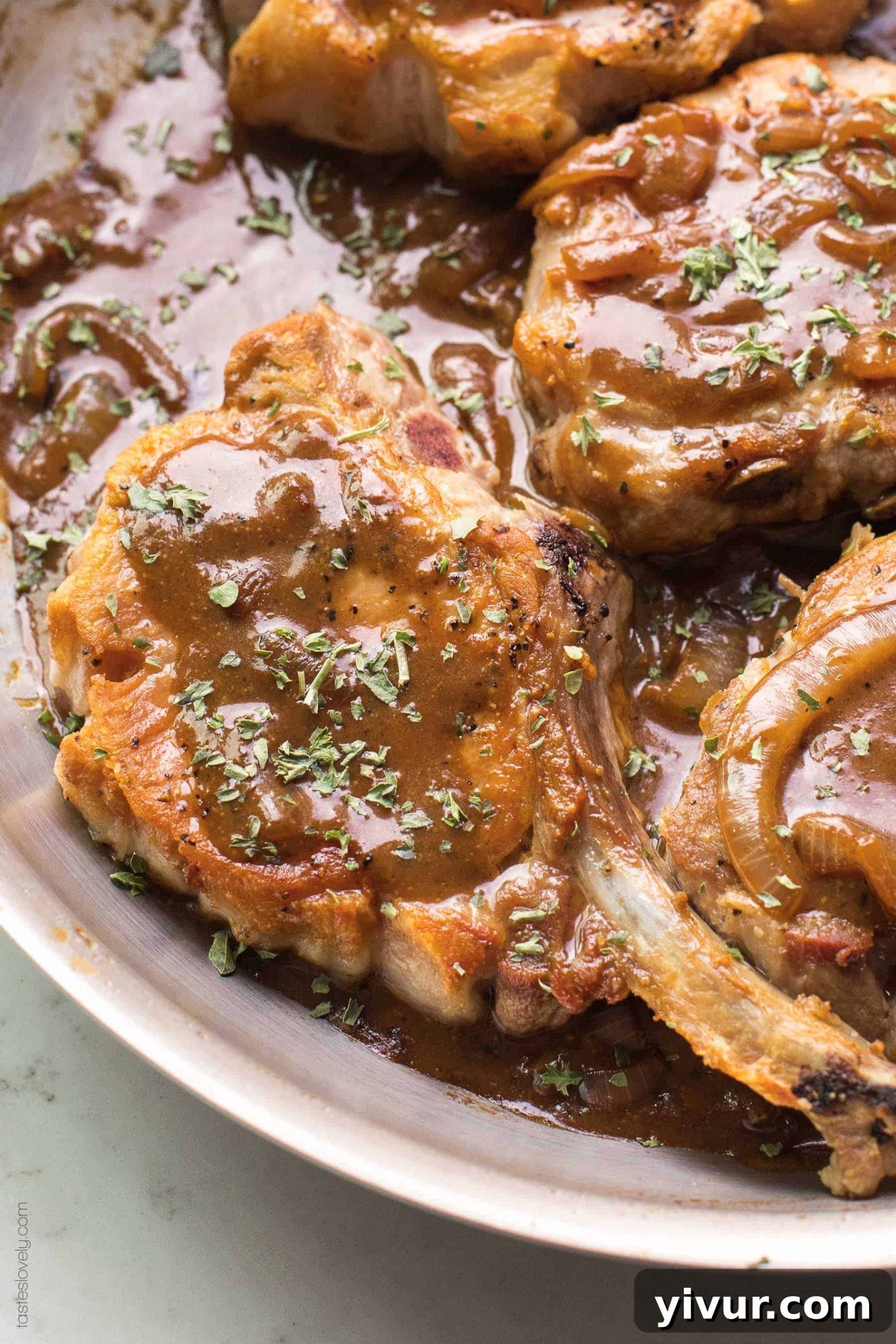 Flavorful Balsamic Mustard Pork Chops Whole30 and Keto 5 Pork chops in a brown sauce in a skillet