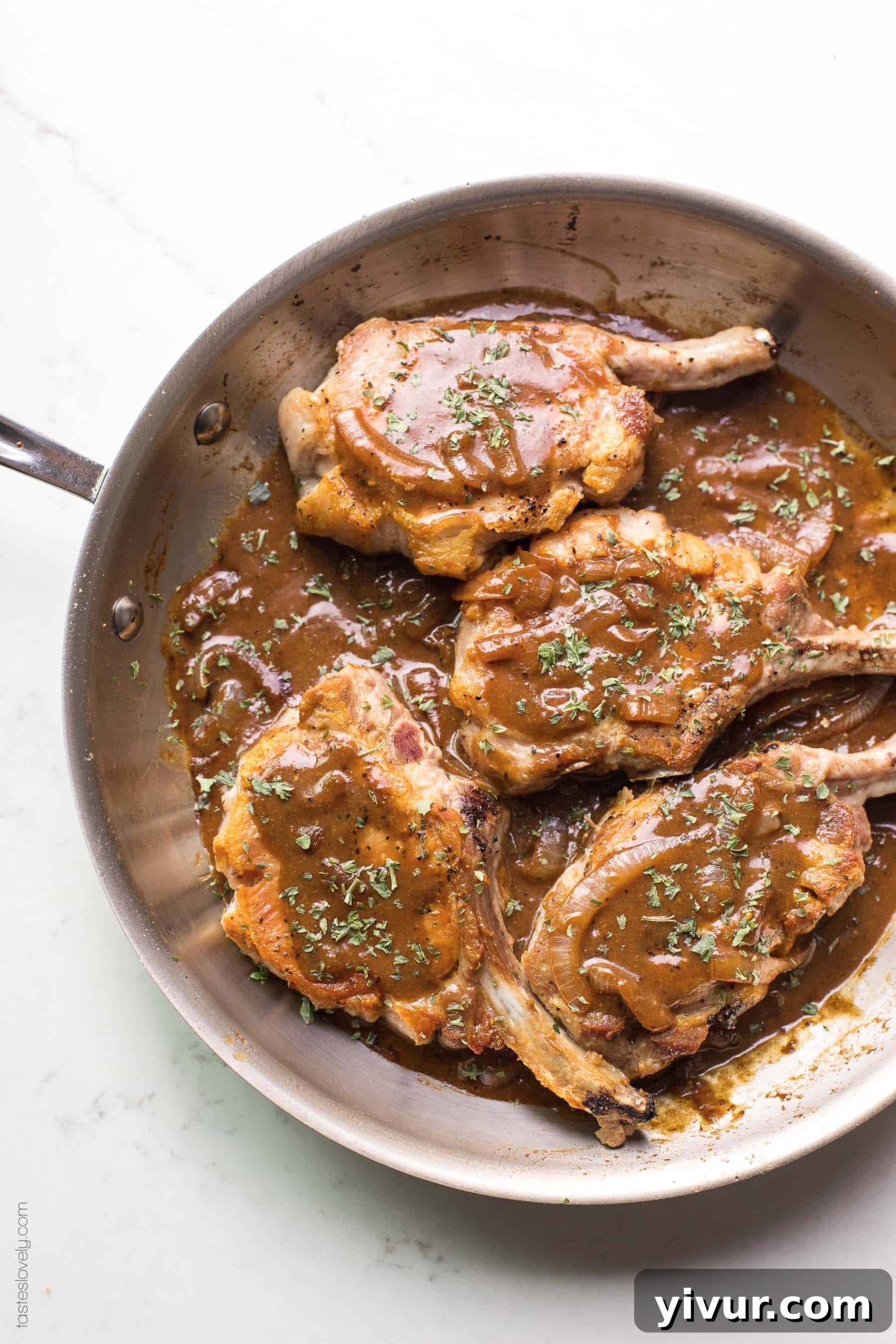 Flavorful Balsamic Mustard Pork Chops Whole30 and Keto 6 Pork chops in a brown balsamic mustard sauce in a skillet