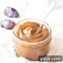 A small jar of date paste with a decorative label, emphasizing its homemade quality.