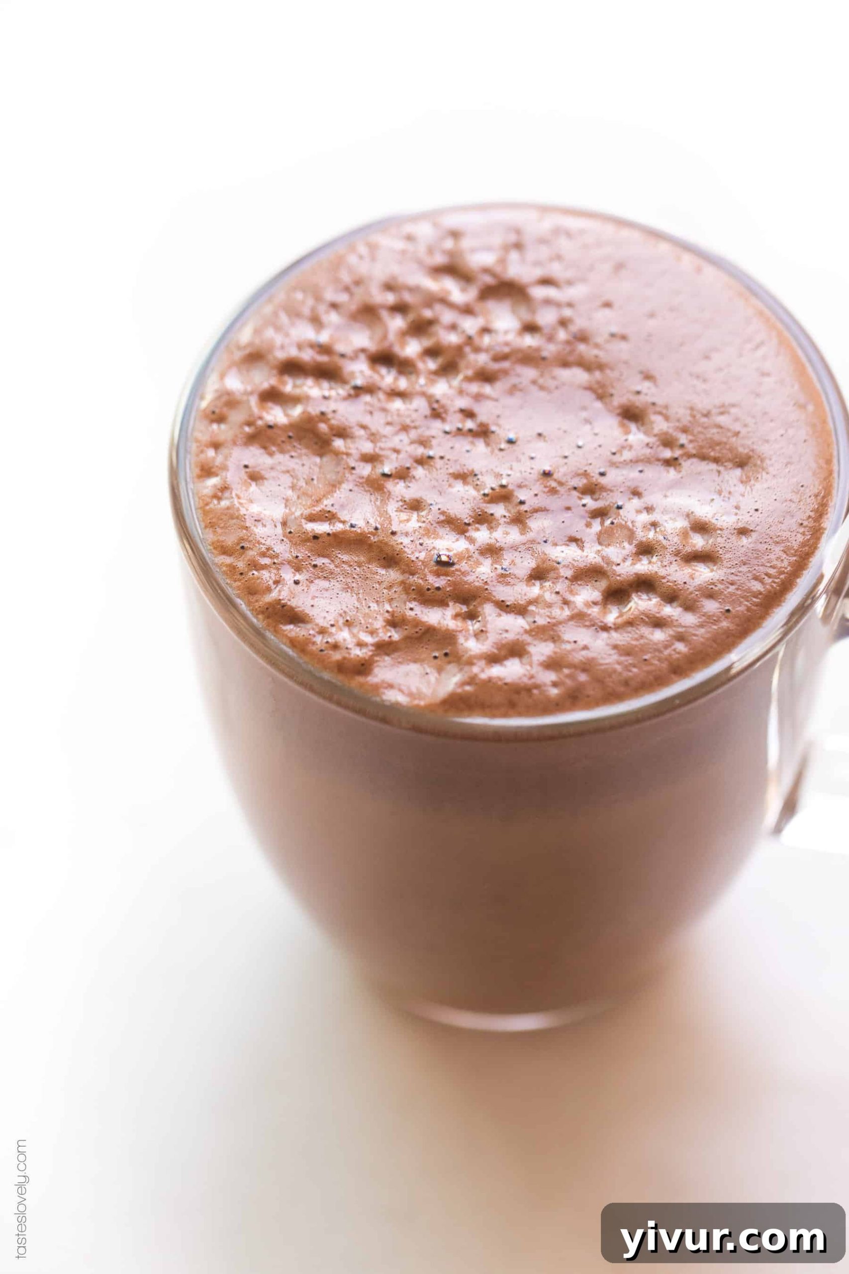 A close up shot of a delicious Paleo Whole30 Mocha in a coffee cup, highlighting its rich color and creamy texture