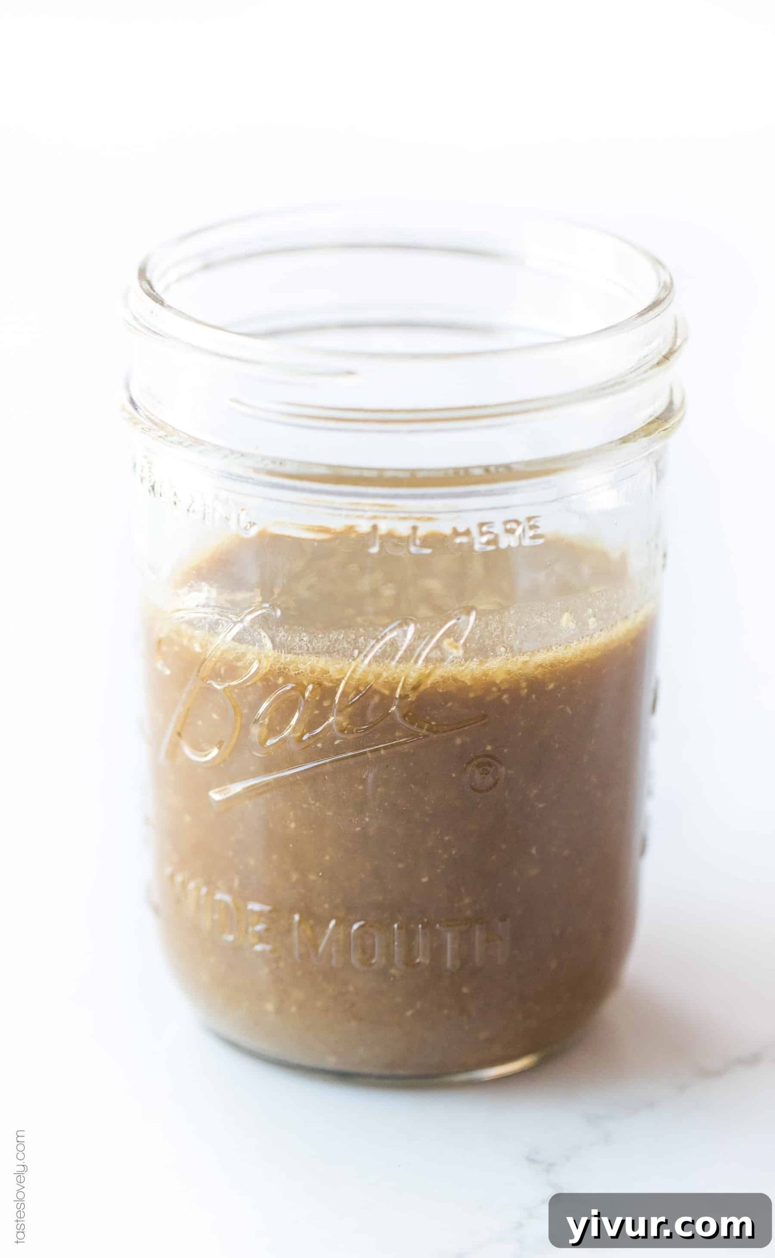 Delicious 5 Minute Whole30 and Paleo Stir Fry Sauce Soy Free 3 A mason jar filled with homemade Whole30 and Paleo-friendly stir fry sauce, ready for use